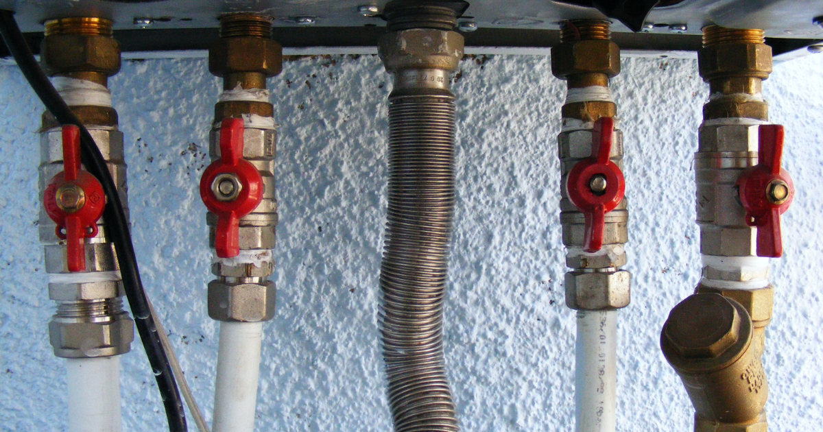 Commercial plumbing pipes and shutoff valves installed by PlumbPro